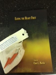The gris gris bag for courage with Clare's book of poetry, my prizes from Words of Fire, Words of Water.